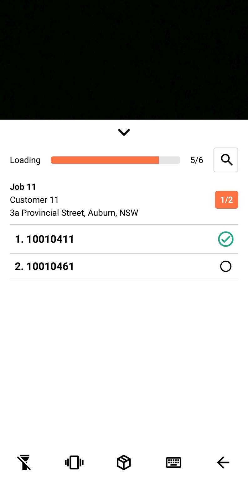 A job expanded to unit level, with one barcode ticked and one not